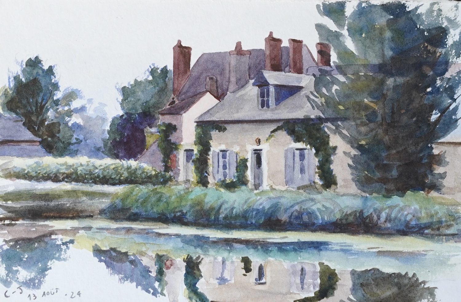 Watercolour of a pale French manor house among trees, its shutters blue, reflected in still water in the foreground